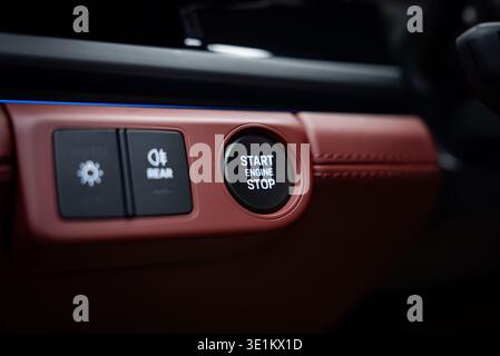 Porsche Panamera 4 push button ignition on red leather dashboard Stock Photo