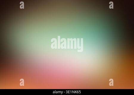 Abstract blurred background with soft gradient colors of green, pink, and orange creating a smooth, dreamy visual effect suitable for various design Stock Photo