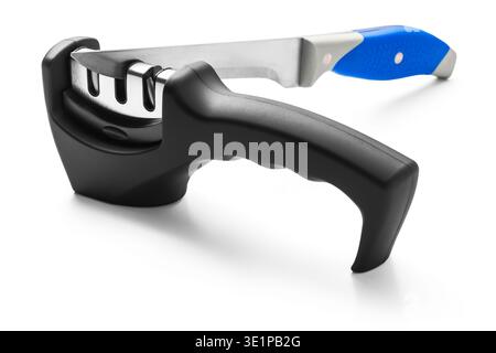 Kitchen Knife in Blade Sharpener cutlery tools isolated on white background Stock Photo