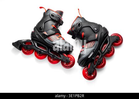 Black And Red Inline Roller Skates With Red Wheels For Fitness And Fun Adventure Outdoor, Roller blades isolated on white background Stock Photo