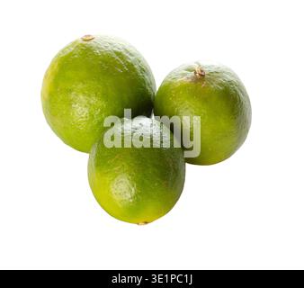 Group of three fresh green limes isolated on white background. Citrus fruit ideal for beverage design, cocktails, cooking, and healthy food concepts. Stock Photo