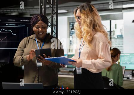 Powerful team of professional women meets in the boardroom to align goals and discuss insights of a multinational company, driving success through collaborative development and strategy. Stock Photo