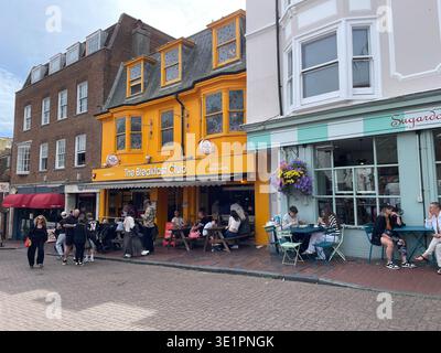 Brighton Lanes street with colourful cafes and outdoor seating, pedestrians and shoppers in historic shopping quarter, Brighton, England Stock Photo