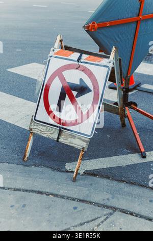 Caution sign stands on a wooden walkway inside a stone passage Stock ...