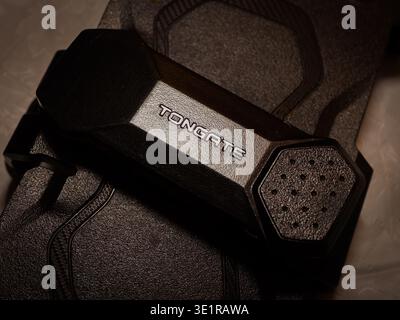Tongate cellular phone holster belt clip on a dark textured background Stock Photo