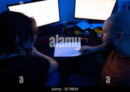 High Angle View of Couple Brainstorming Stock Photo
