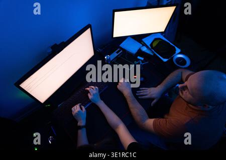Top View of Couple Using Computer Together Stock Photo
