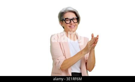 Happy mature woman clapping hands demonstrating success and support Stock Photo