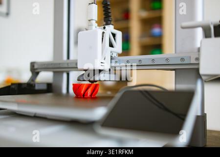 3D Printer Creating Red Object Stock Photo
