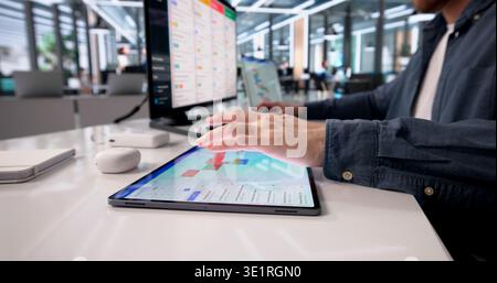 Focused Professional Managing A Packed Calendar On Desktop During Virtual Conference Stock Photo