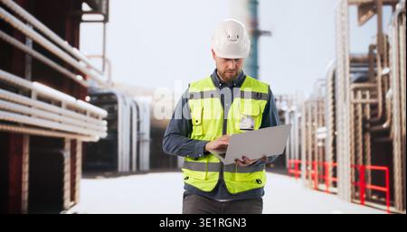 Engineer Closely Oversees Refinery Control Systems Ensuring Safe Energy Operations Stock Photo