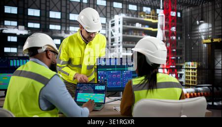 Diverse Group Of Engineers And Scientists Designing Rocket Parts On Computers. People In Aerospace Stock Photo