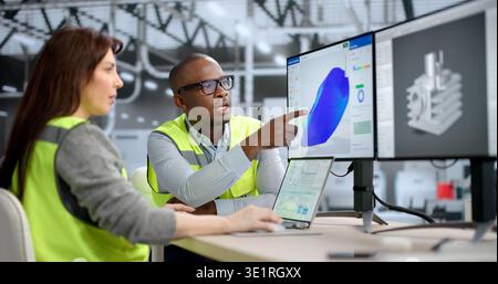 An Engineer Uses CAD Software On A Computer To Design And Simulate Product Stress. A Mechanical Designer Collaborates Stock Photo