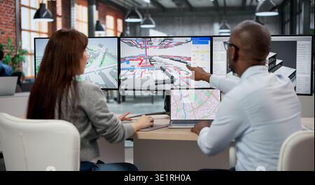 Man And Woman Discuss BIM 3D Model Design On Computer Screen, Planning Building Project Details Stock Photo