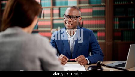 Two Professionals Discussing Business Partnership Legal Advice During A Serious Meeting. A Lawyer Stock Photo