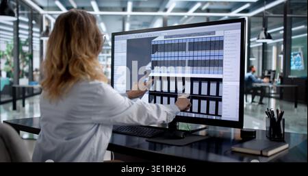 Female Architect Using 3D BIM Technology For Building Design Stock Photo