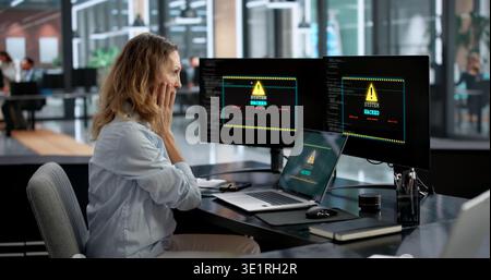Woman Working As Business Analyst Faces Ransomware Cyber Attack On Laptop. Stock Photo