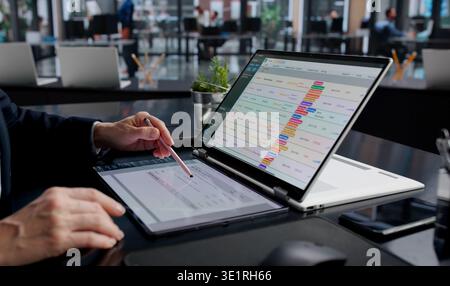 Corporate Accountant Analyzing Invoices And Payroll Data On Office Computer Stock Photo