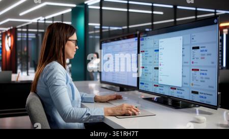 Female Finance Manager Analyzes Business Expenses With Cutting-Edge Digital Tools Stock Photo