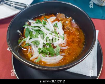 Ostri, Traditional Georgian beef stew in bowl. Georgian cuisine in restaurant. Stock Photo