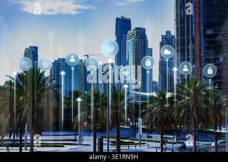 City skyline with digital icons showing technology trends in urban areas Stock Photo