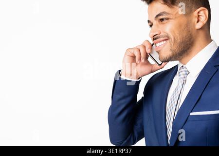 Portrait Of Latin Businessman Having Phone Conversation, Isolated On White Stock Photo