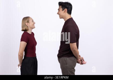 Young man and woman talking face to face Stock Photo