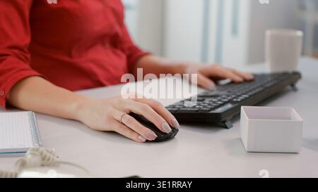 Financial analyst using marketing statistics on computer to plan development strategy with charts and graphs. Office worker working on executive research project. Handheld shot. Close up. Stock Photo