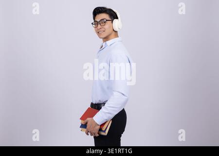 Student with notebook and backpack posing Stock Photo