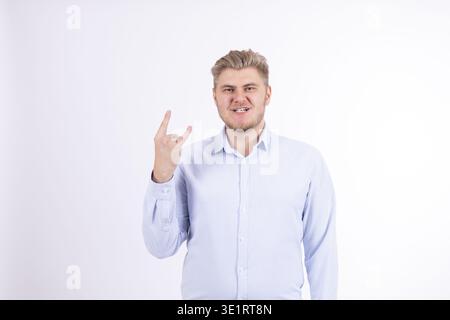 Man showing victory sign and smiling Stock Photo