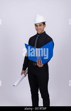 Architect holding blue folder looking at camera Stock Photo