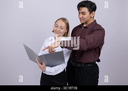 Man and woman checking documents in a folder Stock Photo
