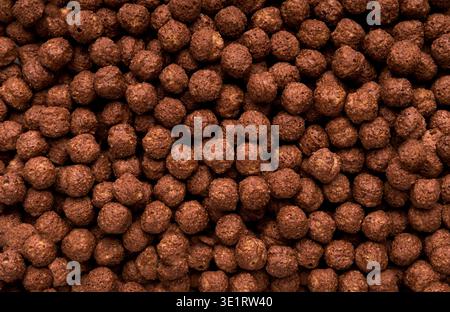 Chocolate breakfast cereal balls background Stock Photo