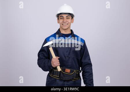 Construction worker holding a hammer Stock Photo