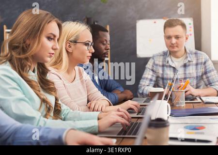 Programmers working in software developing company Stock Photo