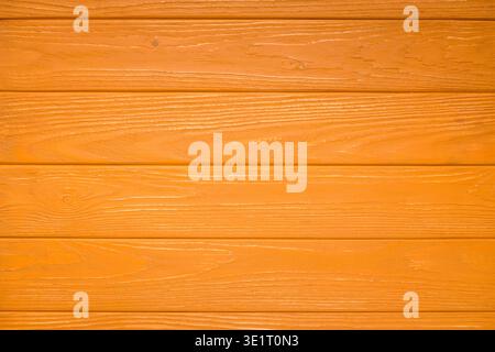 Orange wooden table, bright natural background, top view Stock Photo