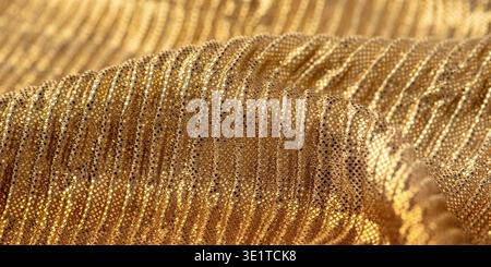A close-up shot of gold sequin fabric Stock Photo