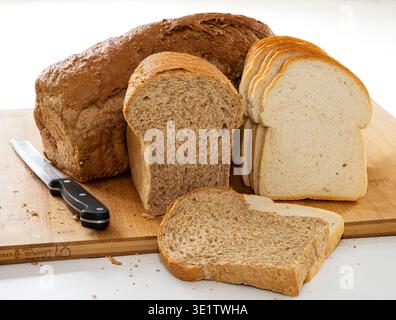 Netherlands - Three different types of bread. Whole wheat bread: made from the entire grain. Brown bread: made with whole wheat flour and plain flour, Stock Photo