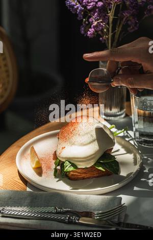 Salmon toast with poached egg and spinach Stock Photo