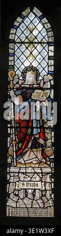 Stained glass window by Percy Bacon & Brothers depicting St Hilda, All Saints Church, Rothbury, Northumberland Stock Photo