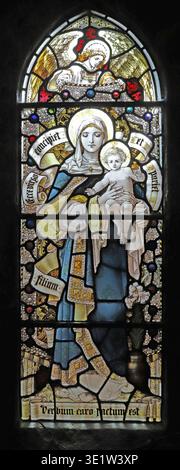 Stained glass window by Percy Bacon & Brothers depicting the Blessed Virgin and Child. All Hallows, Tillington, West Sussex. Stock Photo