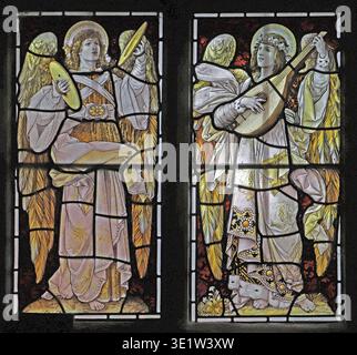 Stained glass window by Percy Bacon & Brothers depicting Angels playing instruments. All Hallows, Tillington, West Sussex. Stock Photo