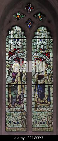 Stained glass window by Percy Bacon & Brothers depicting Saints Nicholas and John, St Nicholas Church, Brandiston, Norfolk Stock Photo