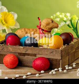 lamb made of bread, eggs painted in different colors, background, wallpaper, Easter composition, festive details Stock Photo