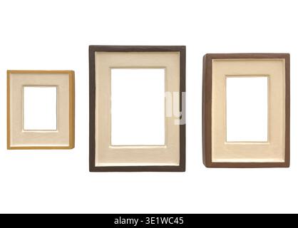 Set of three wooden picture frames with beige mat passepartout isolated on white background. Vertical rectangle borders surround blank copyspace, form Stock Photo