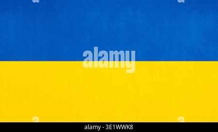 Ukrainian flag colours in grunge texture effect as background or design element. National flag of Ukraine. Stock Photo
