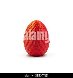 Red 3D printed dragon egg with scale texture isolated on white background Stock Photo