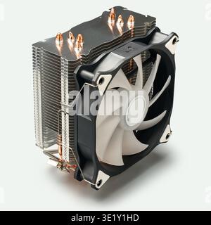 tower type cpu air cooler with aluminum heatsink and white fan isolated light gray background, copper heat pipes and black plastic frame assembly Stock Photo