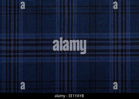 Seamless blue plaid textile pattern with intersecting dark lines, ideal for backgrounds, fashion, textiles, and design projects. Stock Photo