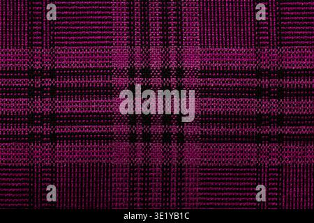 Vibrant pink and black tartan fabric texture with geometric lines and classic plaid squares, ideal for backgrounds and textile designs. Stock Photo